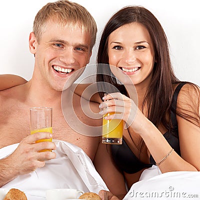 Youg couple drinking juice Stock Photo