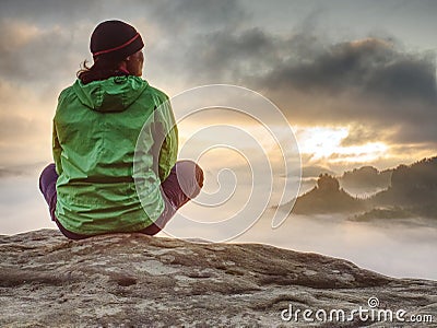 Young active woman with trekking equipment sitting, relaxing Stock Photo