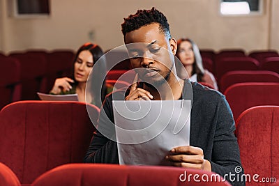 Actor and actresses reading scripts in Stock Photo