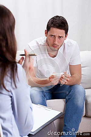 Young addicted man on therapy Stock Photo