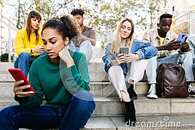 Young addicted people using smart phone outdoors. Stock Photo