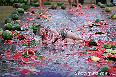 Young adult Asian woman having fun at The Chinchilla Melon Festival Editorial Stock Photo