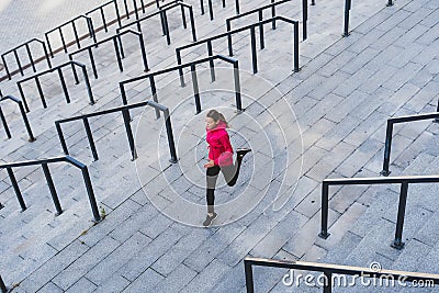 Young adult athlete woman running on sport training in city Stock Photo