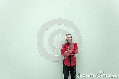 Young adult businessman crossed hands and looking at camera. Stock Photo