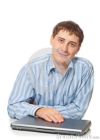 Young adult businessman sitting with closed laptop Stock Photo