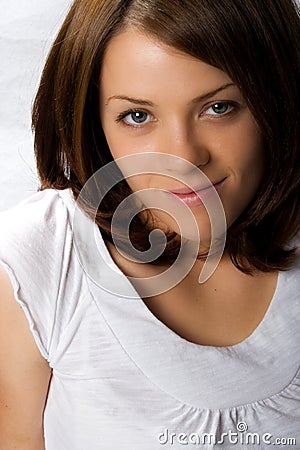 Young adult. Female. Brunette, blue eyes. Stock Photo