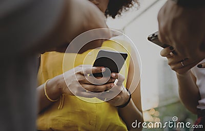 Young adult friends using smartphones outdoors Stock Photo