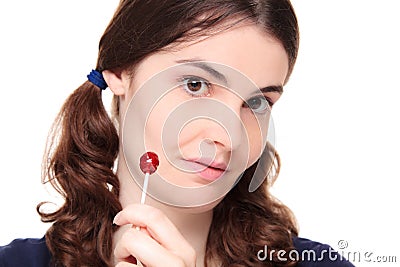 Young adult woman in pigtails with lollipop Stock Photo