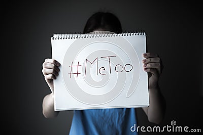 Woman holding notebook with MeToo written on page Stock Photo