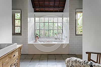 Young adult woman taking bath at home Stock Photo