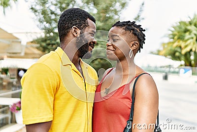 Young afircan american couple smiling happy and hugging at the city Stock Photo