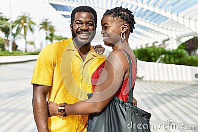 Young afircan american couple smiling happy and hugging at the city Stock Photo