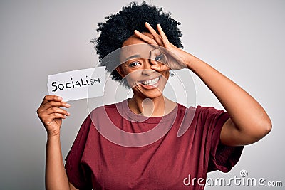 Young African American afro politician woman with curly hair socialist party member with happy face smiling doing ok sign with Stock Photo