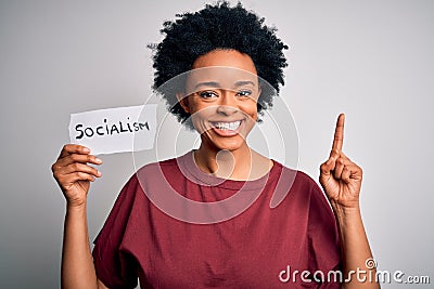 Young African American afro politician woman with curly hair socialist party member surprised with an idea or question pointing Stock Photo