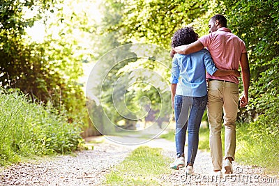 Young African American Couple Walking In Countryside Stock Photo