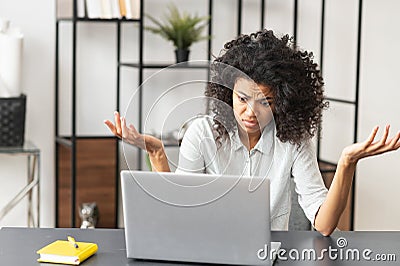 African-American female office worker stressing out Stock Photo