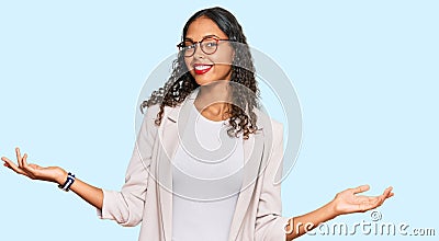 Young african american girl wearing business clothes smiling showing both hands open palms, presenting and advertising comparison Stock Photo