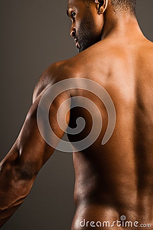 Young African American Man Flexing Triceps Stock Photo