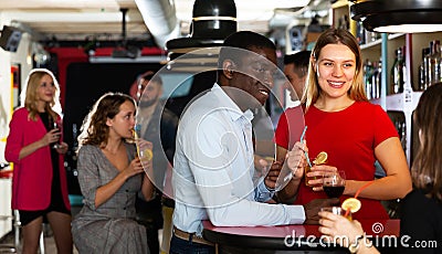 Young african american man flirting with girl on party Stock Photo