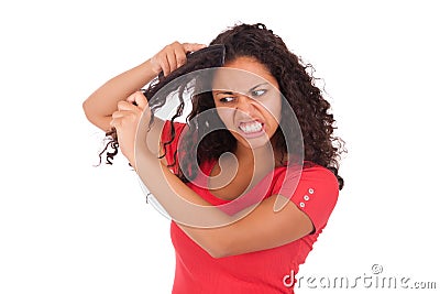 Young african american woman combing hair Stock Photo