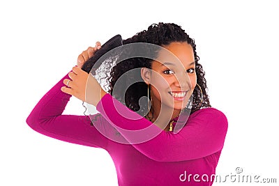 Young african american woman combing hair Stock Photo