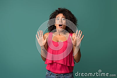 Young african-american woman disgusted over blue background Stock Photo