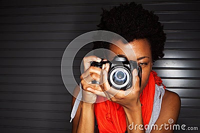 Young African American woman taking photos. Stock Photo