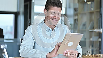 The Young African Man doing Creative work on Tablet Stock Photo