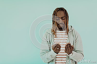 Young African Muslim Man Making Traditional Fatiha Prayer To Allah Stock Photo