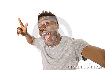 Young afro american man smiling happy taking selfie self portrait picture with mobile phone Stock Photo