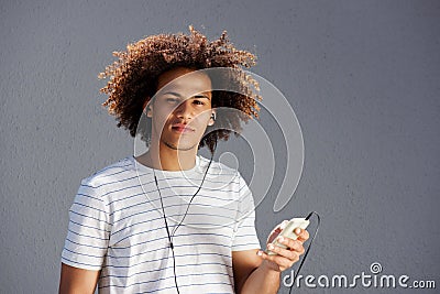 Young afro man with earphones and cellphone Stock Photo