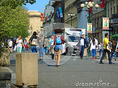 Young Afro woman from behind on the square full of people.Prague, Czech Republic, Editorial Stock Photo