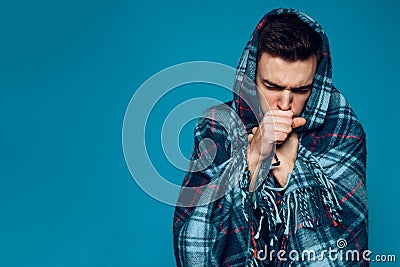 Young ailing guy with influenza virus coughs Stock Photo