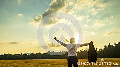 Young ambitious executive enjoying his business success as he st Stock Photo