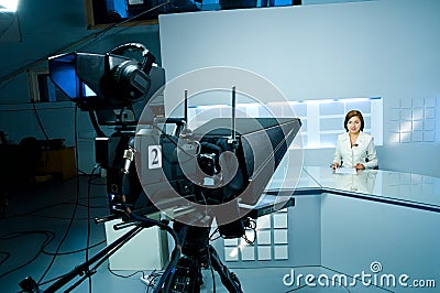 Young anchorwoman at TV studio Stock Photo