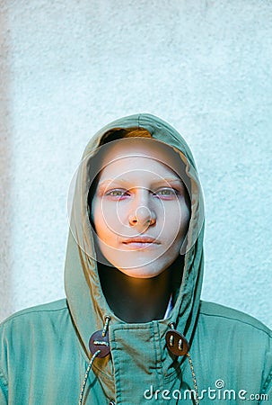 Young Androgyne Woman with short blond hair on the street Stock Photo