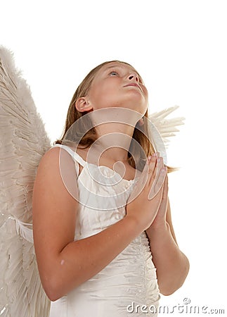 Young angel girl praying Stock Photo