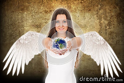 Young angel woman holding Earth in hands Stock Photo