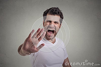 Young angry man screaming to stop stay away Stock Photo