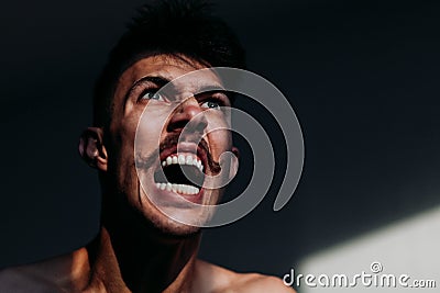 Young angry man expressing negative emotion Stock Photo