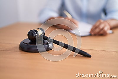 Young arab man judge writing contract at street Stock Photo