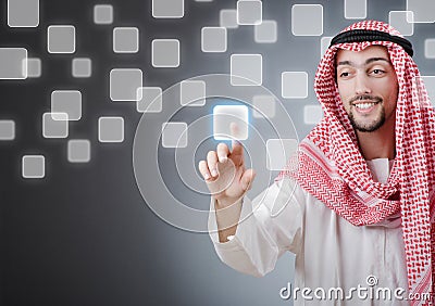 Young arab pressing virtual buttons Stock Photo