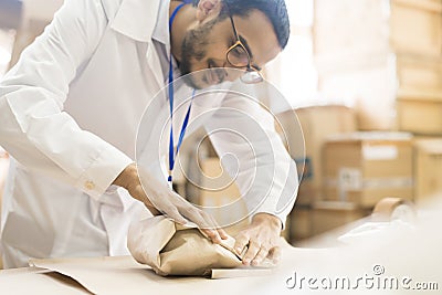 Arabian Worker at Packaging Department Stock Photo