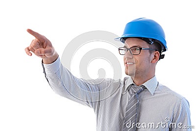 Young architect pointing to distance smiling Stock Photo