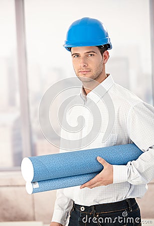 Young architect wearing hardhat Stock Photo