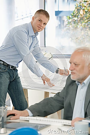 Young architect working on drawing pad Stock Photo