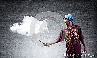 Young artist drawing realistic white cloud Stock Photo