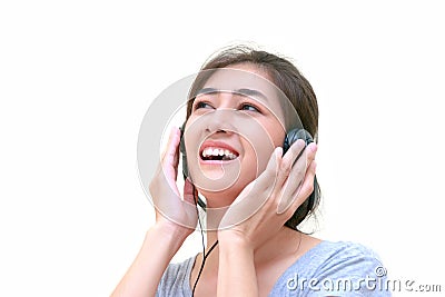 Young Asain woman listening to music and holding hea Stock Photo