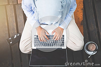 Young asia muslim woman work out office chill on green nature pa Stock Photo