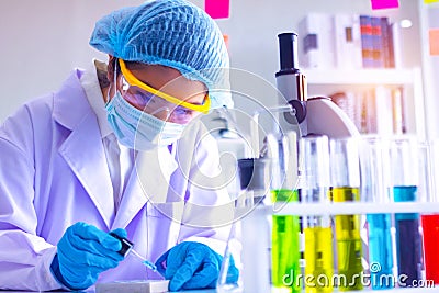 Young Asia woman scientist working in laboratory. Stock Photo